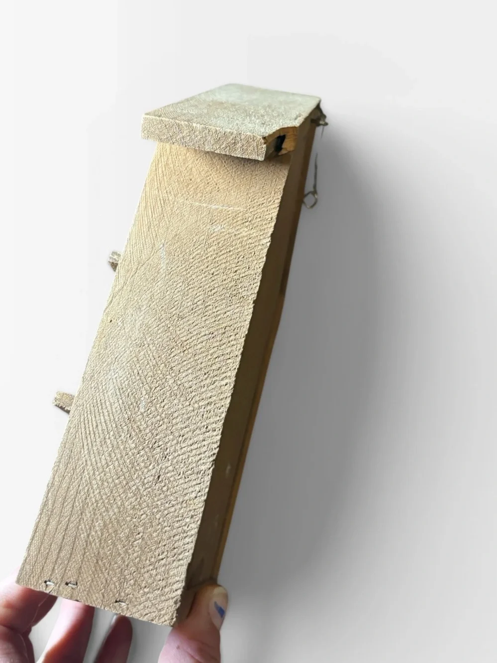Small house trinket shelf hung by wire